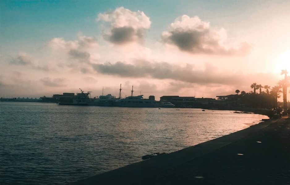 Sunset over paphos harbour