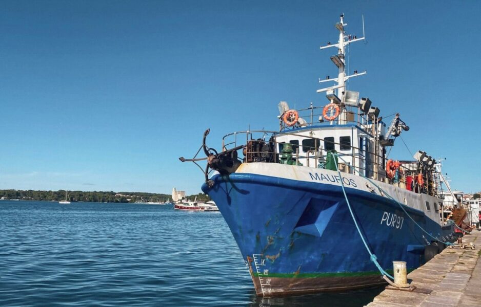 Walking path the boats in Pula waterfront