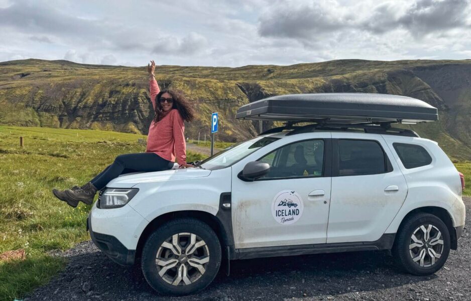 Me on top of our car at the end of our road trip